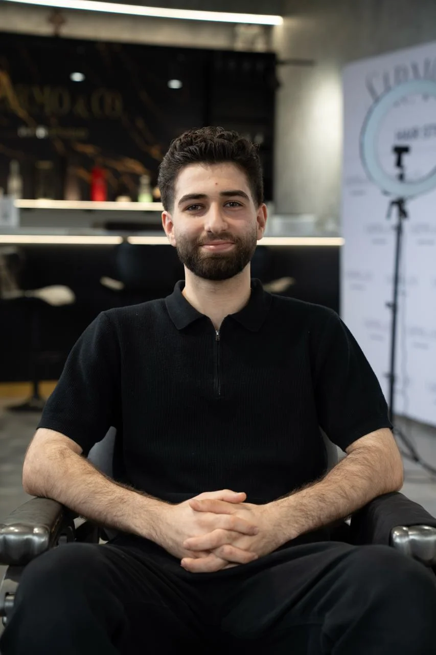 David Rossi, Stylist, creating a modern hairstyle for a client